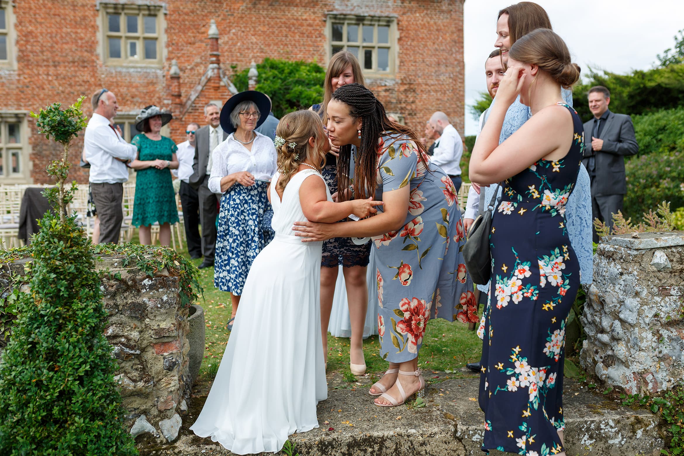 the bride is congratulated by her friends