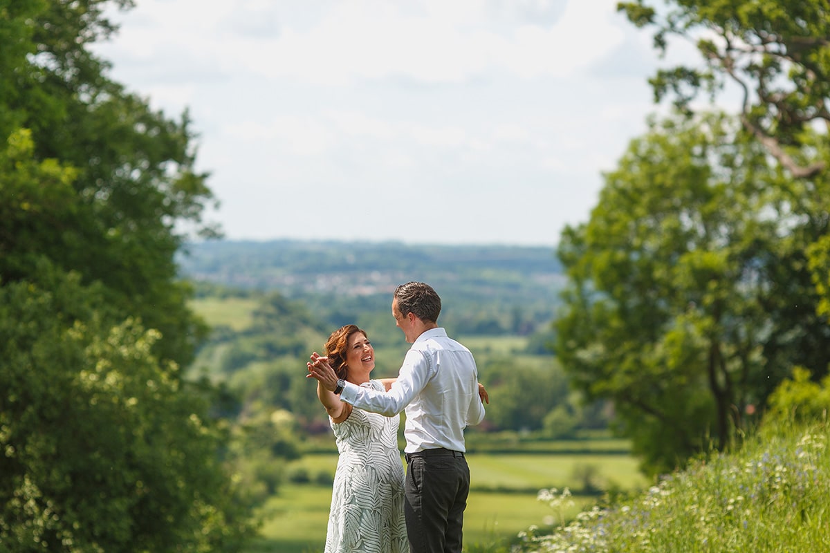 the couple with the buckinghamshire countryside behind