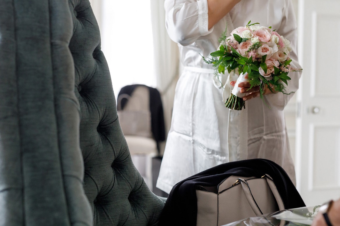 the bride holds her flowers