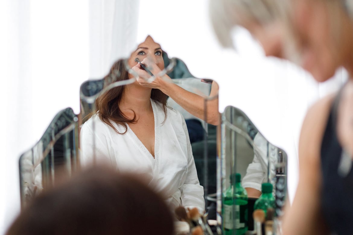 the bride reflected in a mirror