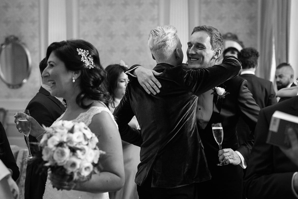 friends congratulate the groom