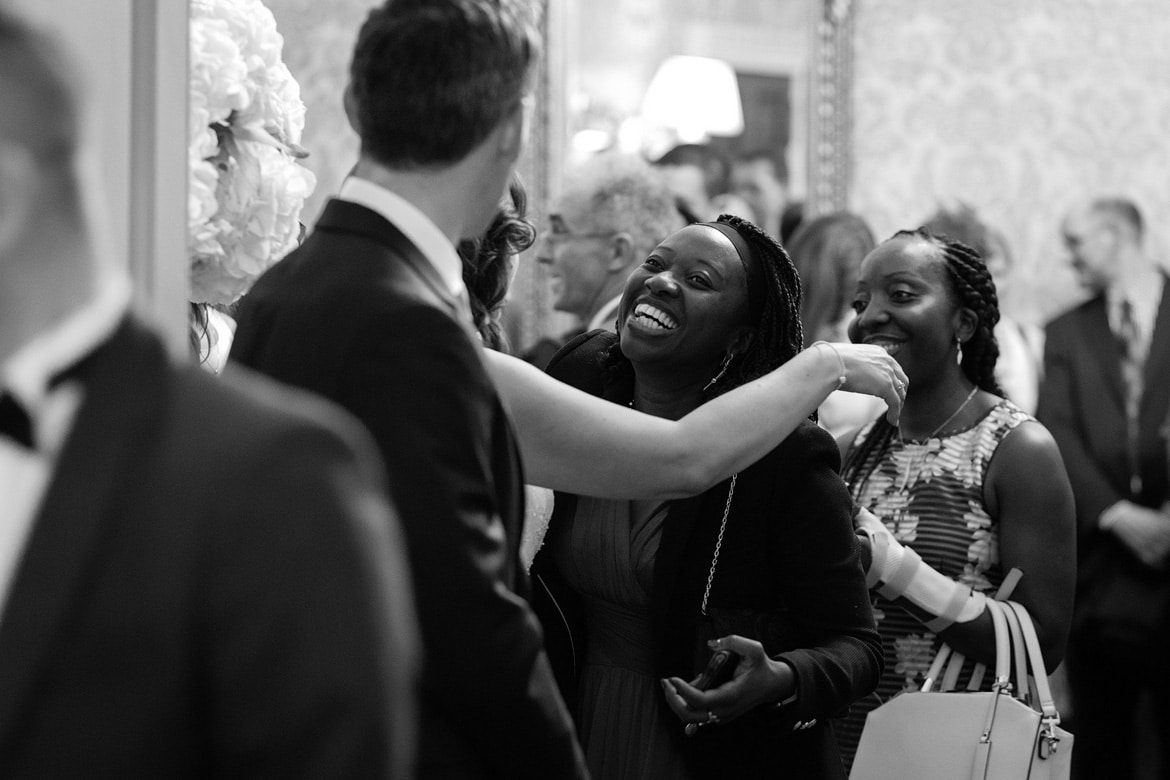 the groom greets guests in the receiving line