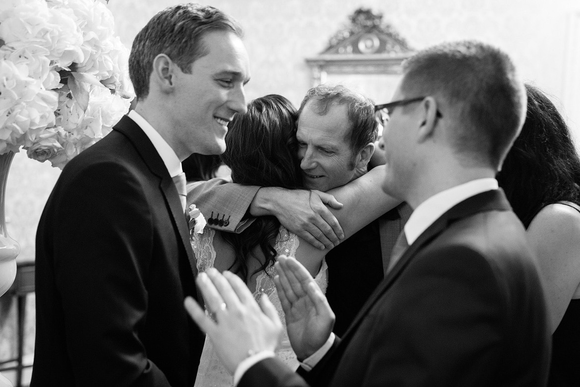 the bride hugs a guest