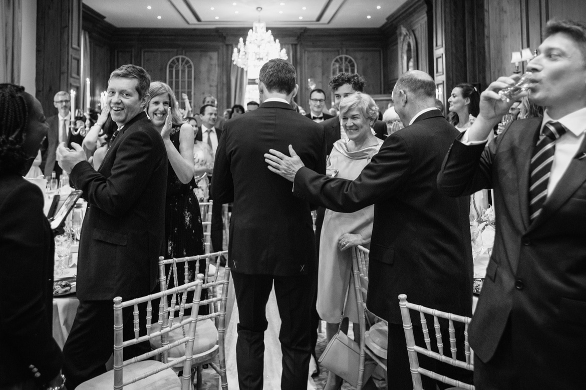 the groom gets a pat on the back