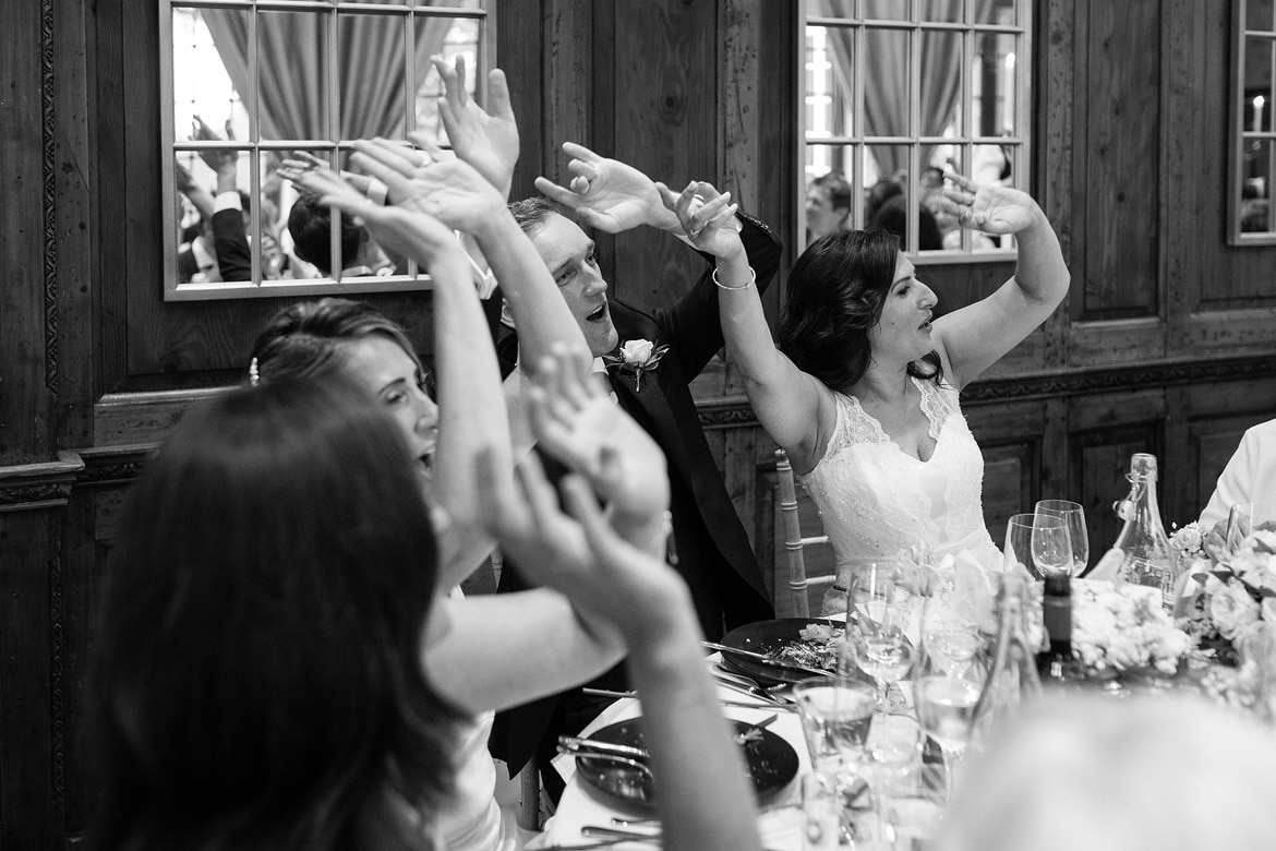 bride and groom sing with the waiters