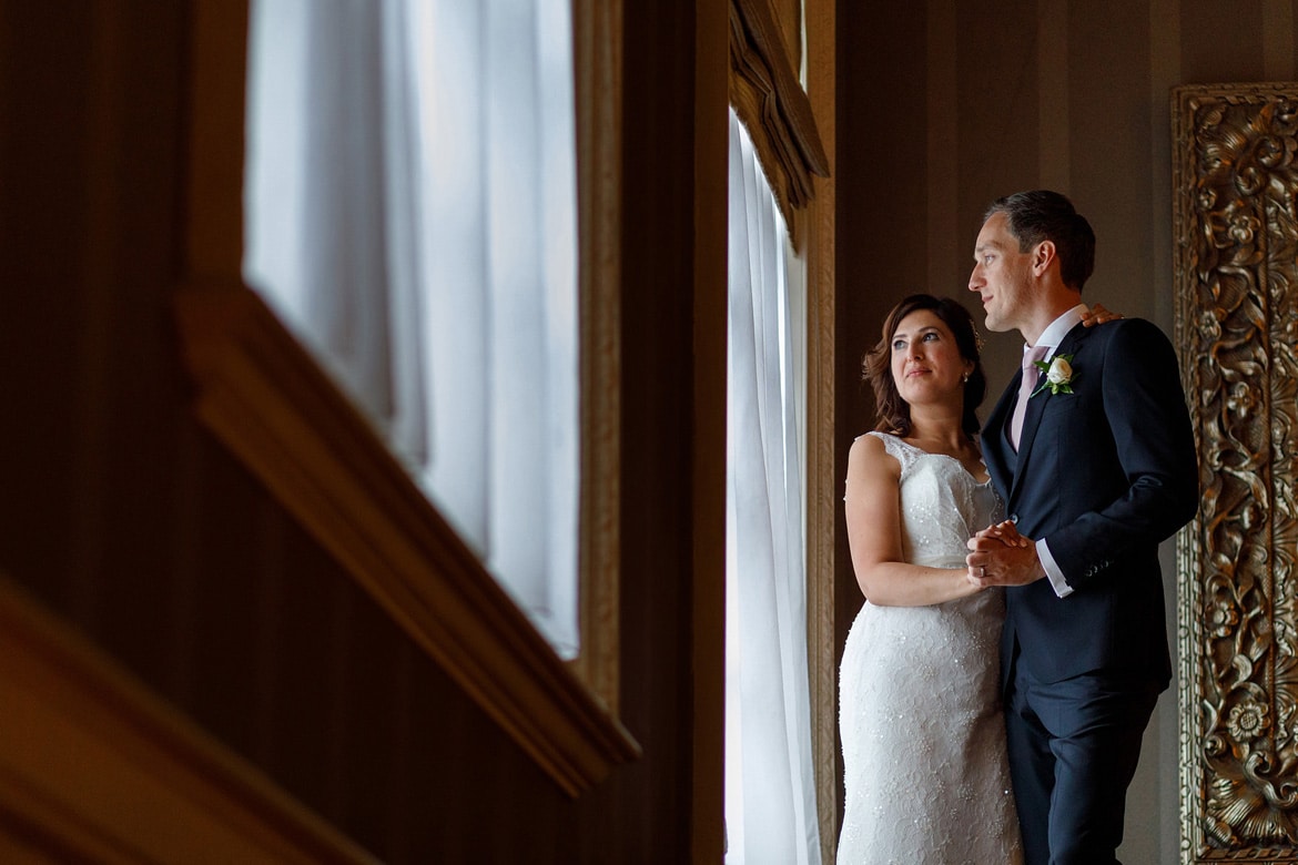 a window portrait at a hedsor house wedding