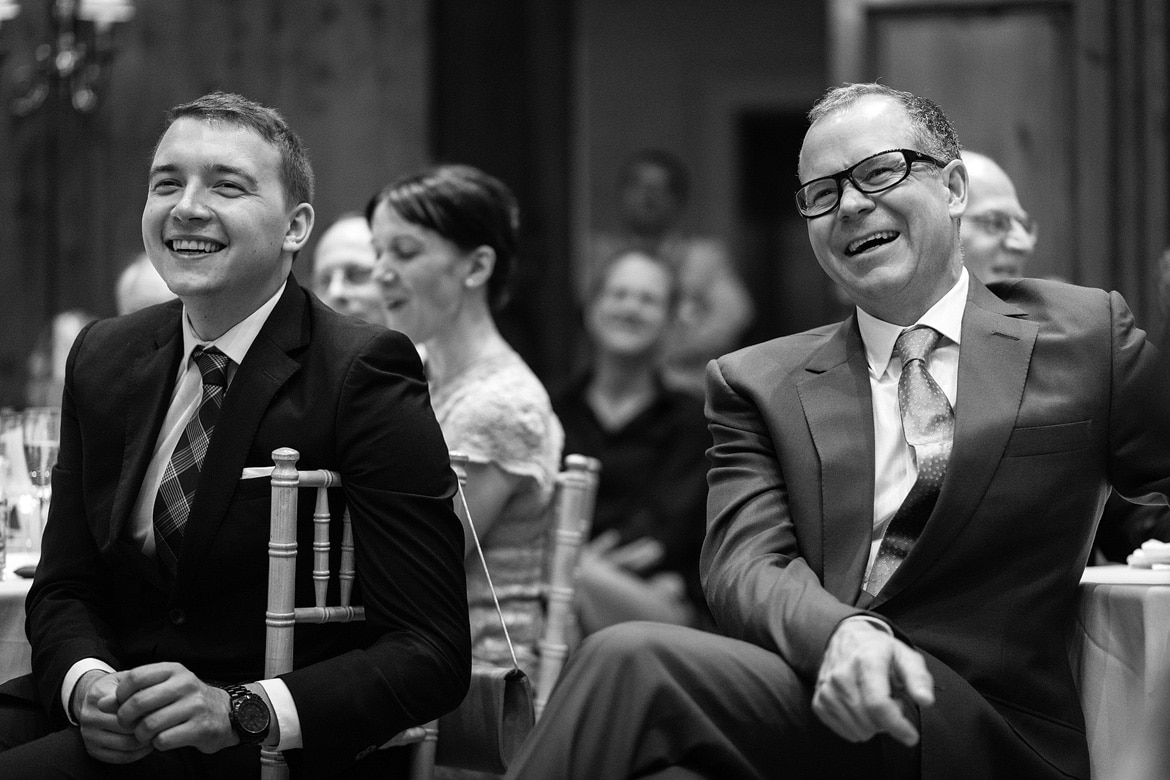 guests laugh during the speeches