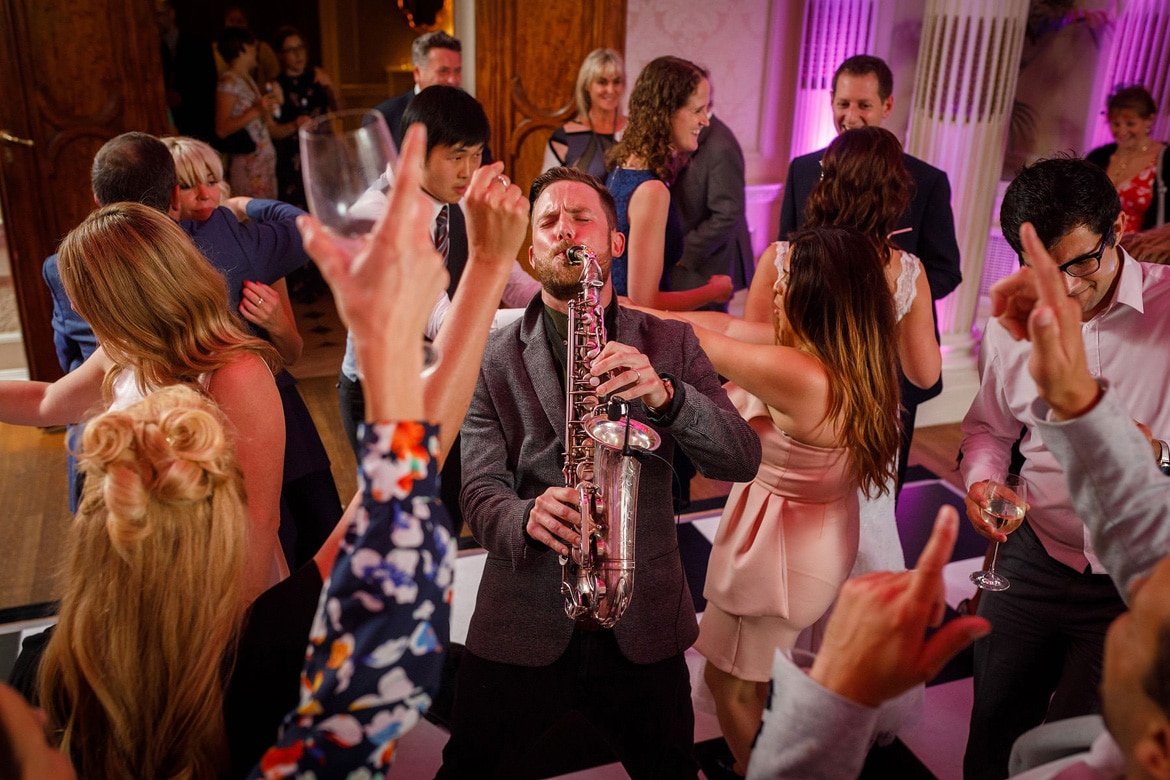 a saxophone player on the dancefloor