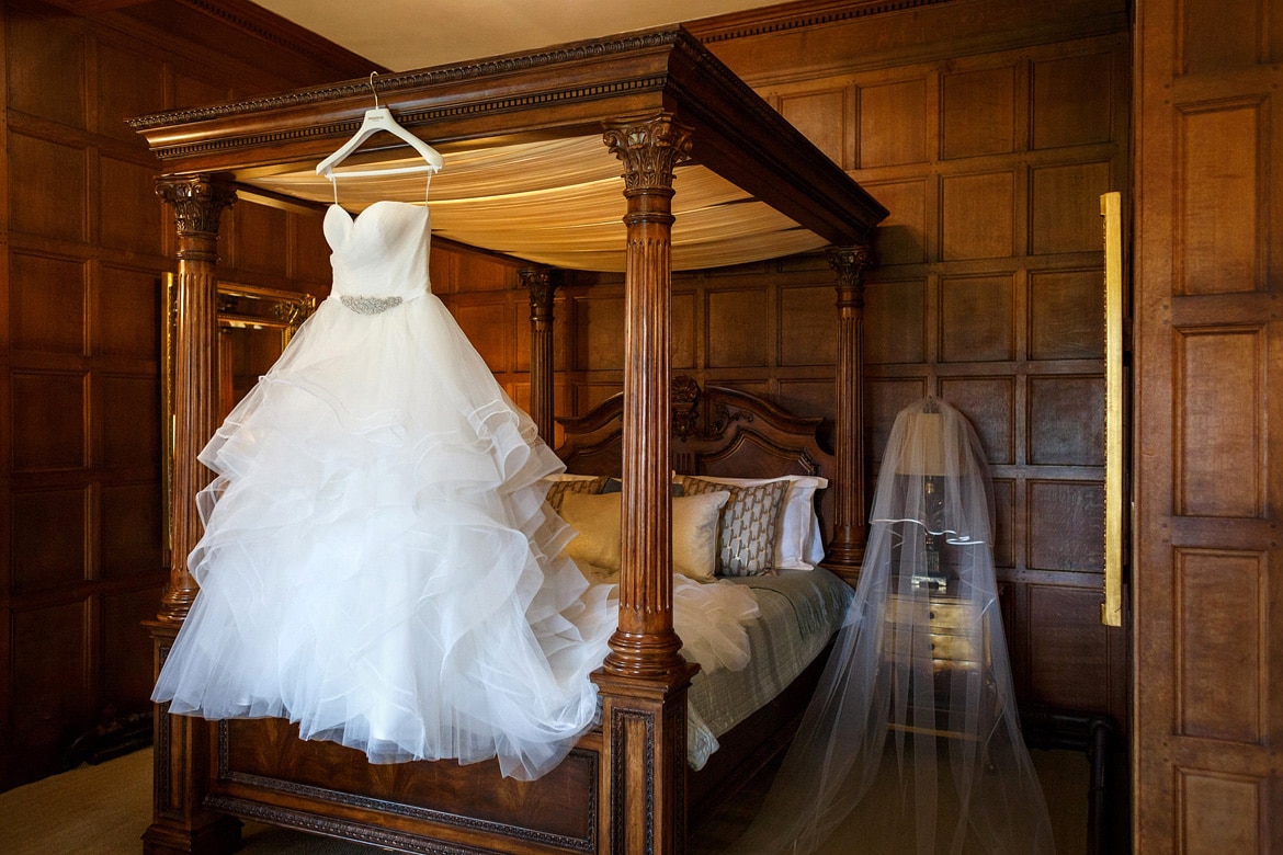 the brides dress hanging in the girls room