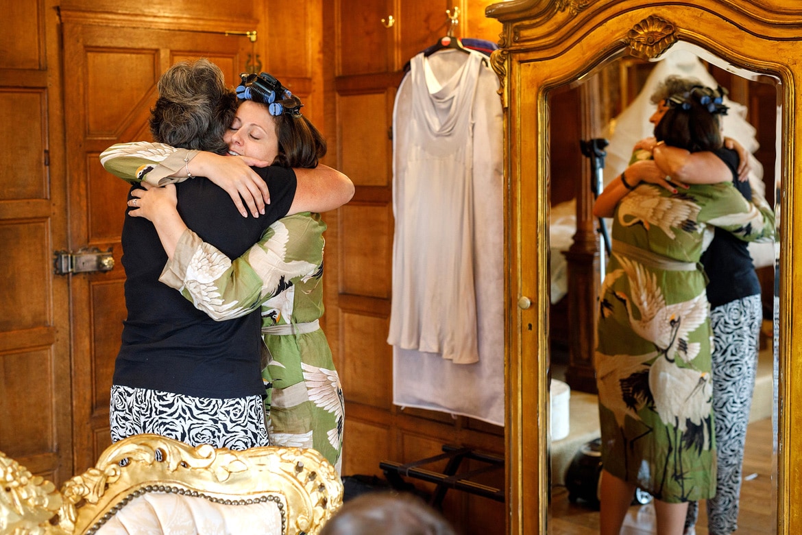 the bride hugs her mother