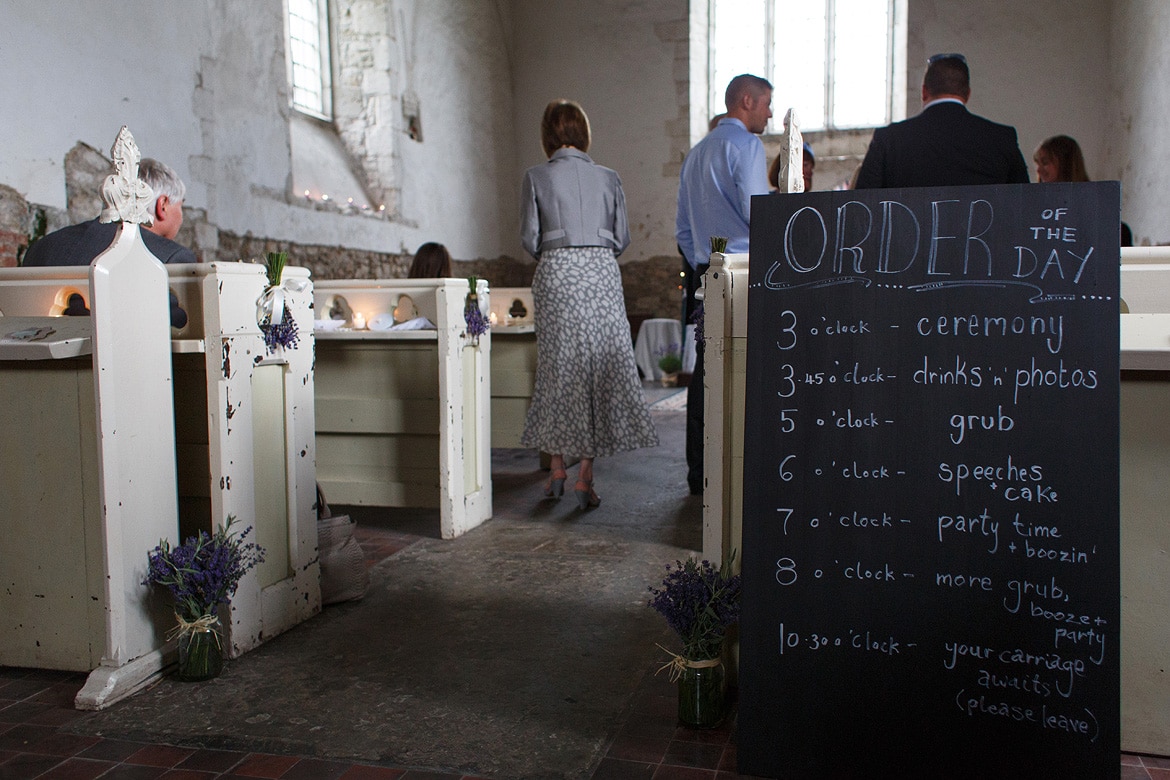 an order of the day sign inside the church