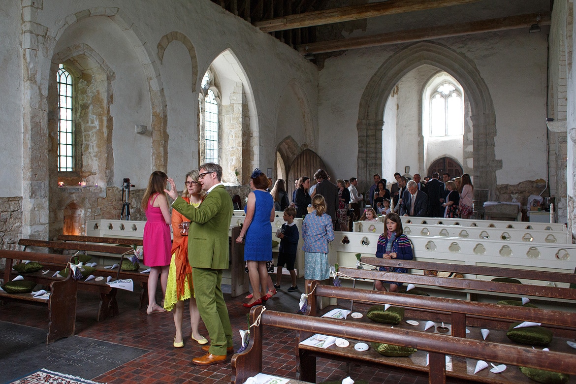 the groom talks to guests