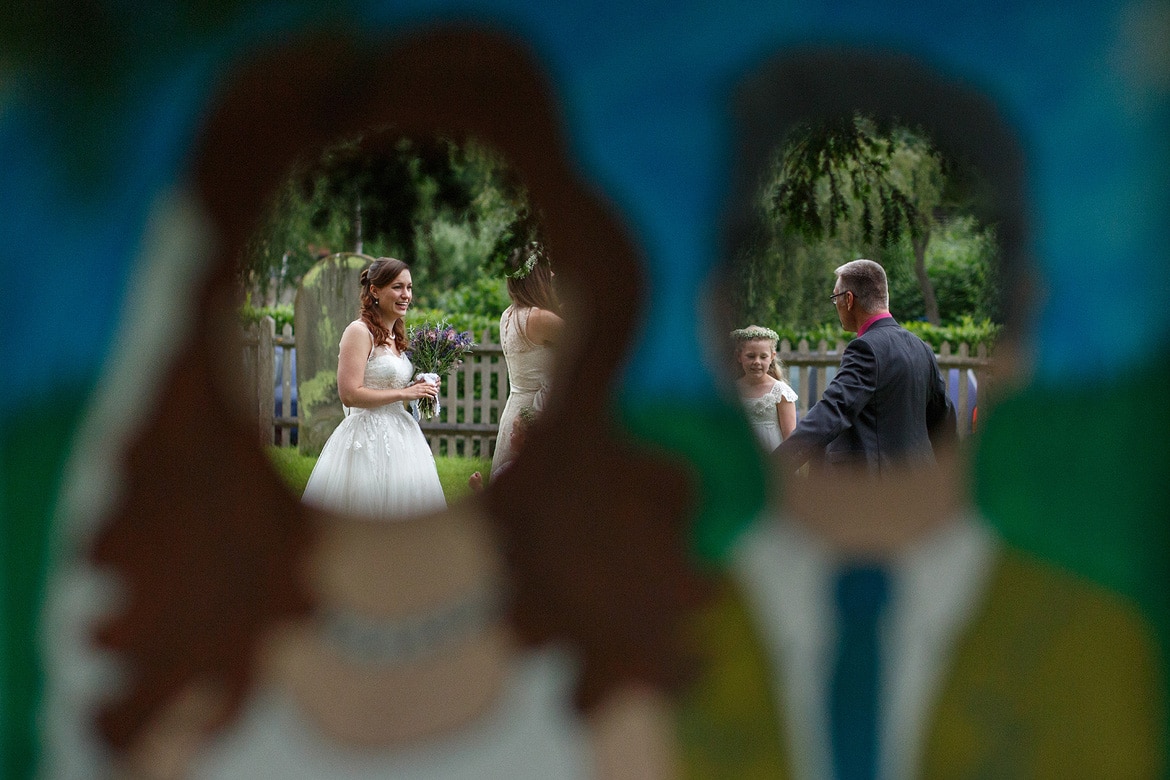 the bride seen through the comedy backdrop