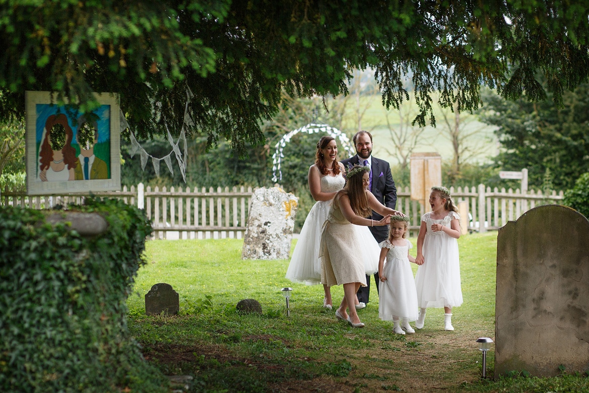 laura and her family walk through the church yard