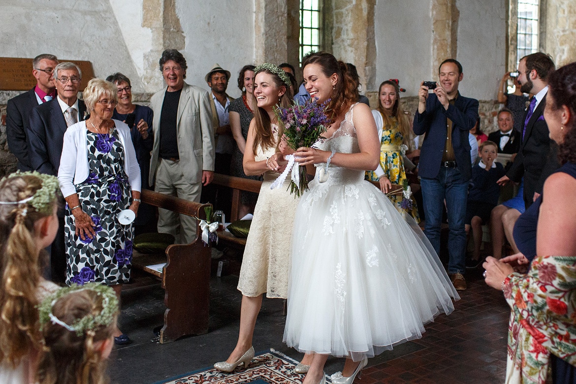 laura and her sister walk down the aisle