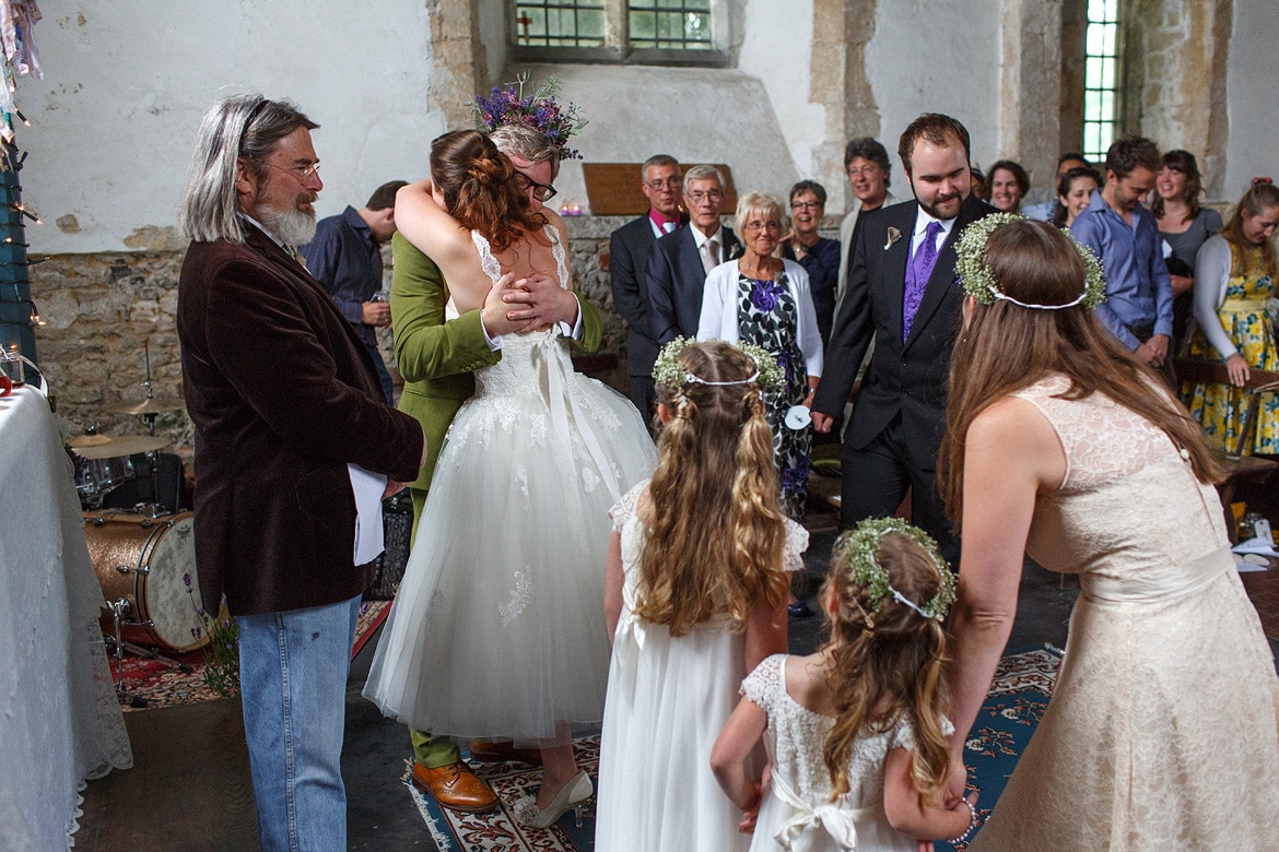 bride and groom embrace before their wedding ceremony