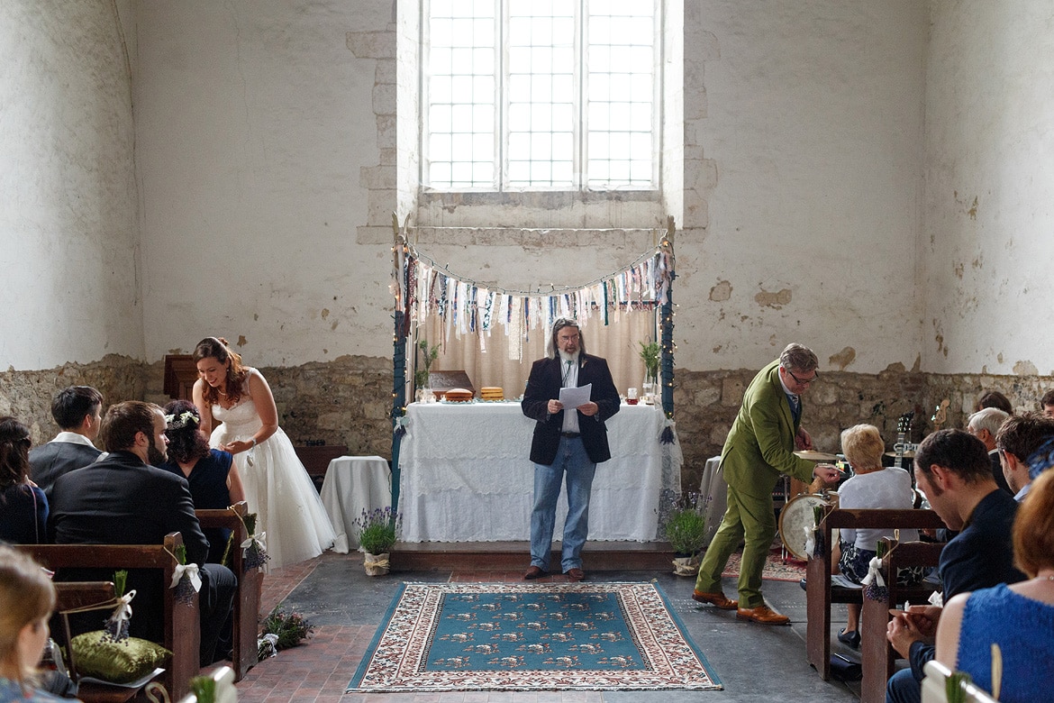 the couple light candles for the guests