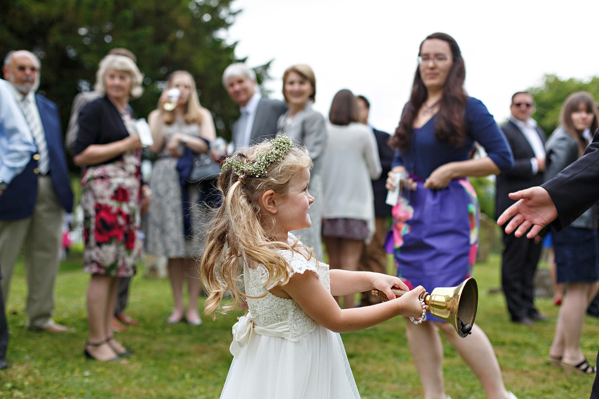 the flowergirl rings to signal the start of the meal