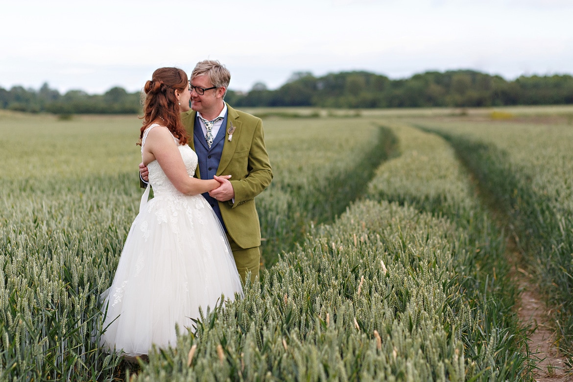 bride and groom in the cornfield