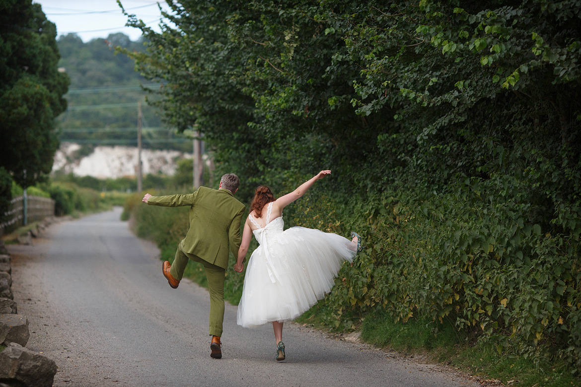 bride and groom messing about during the couple photos