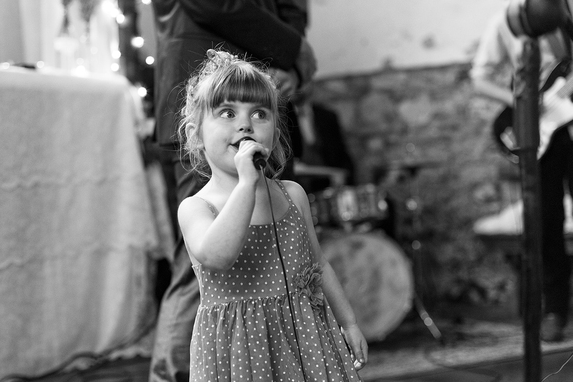 a child sings with the band