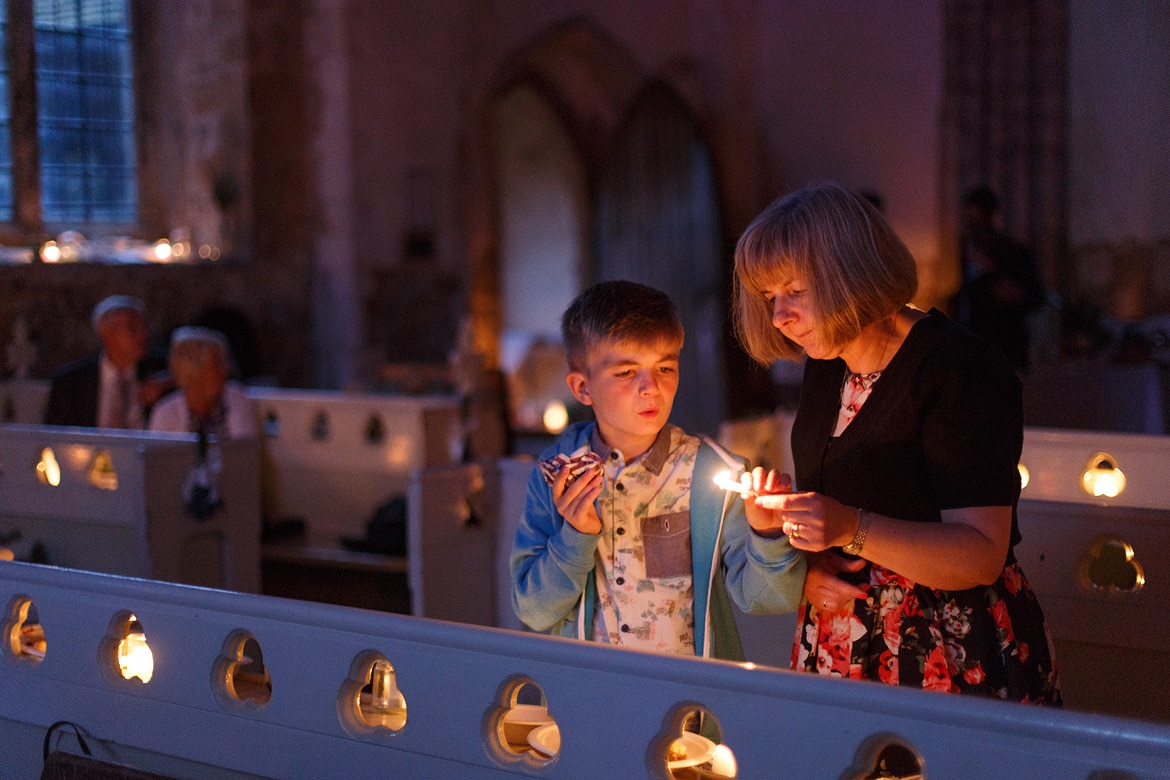 lighting candles as evening falls