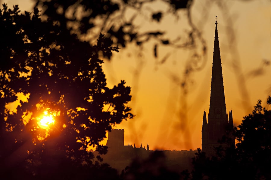 both norwich cathedrals at sunset