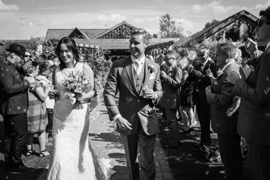 walking through the bubbles at a maidens barn wedding