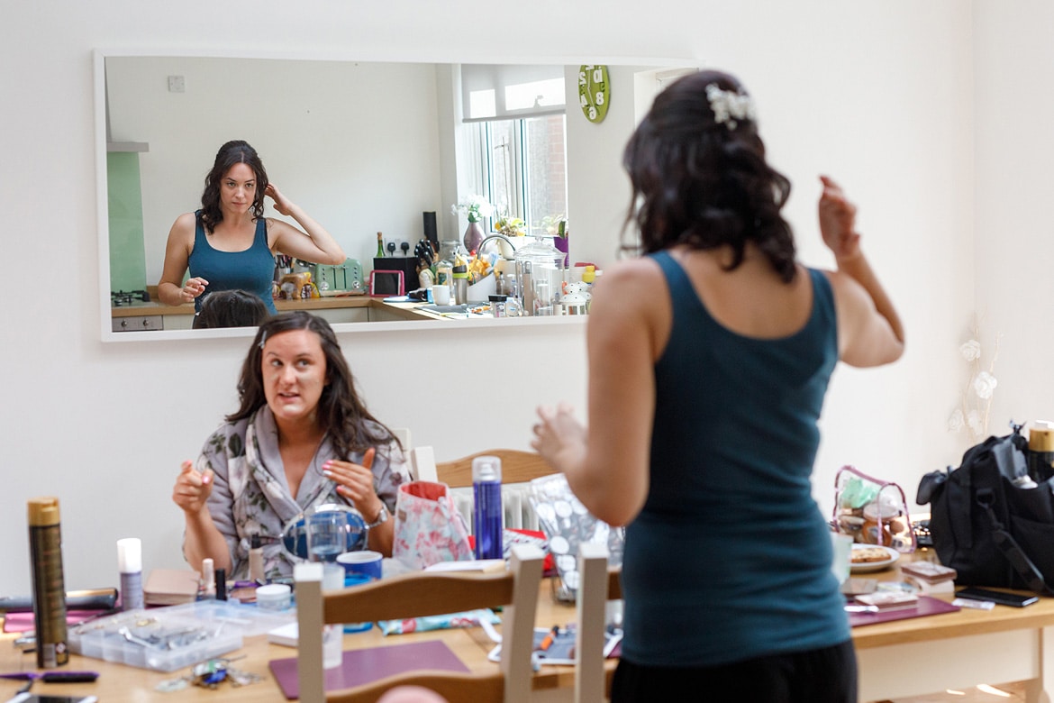 the bride reflected in a mirror during the preparations