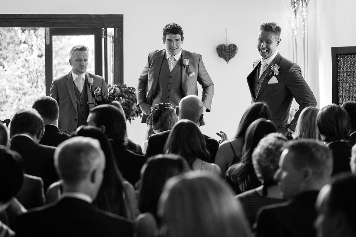 the groom and his best men speak to the guests