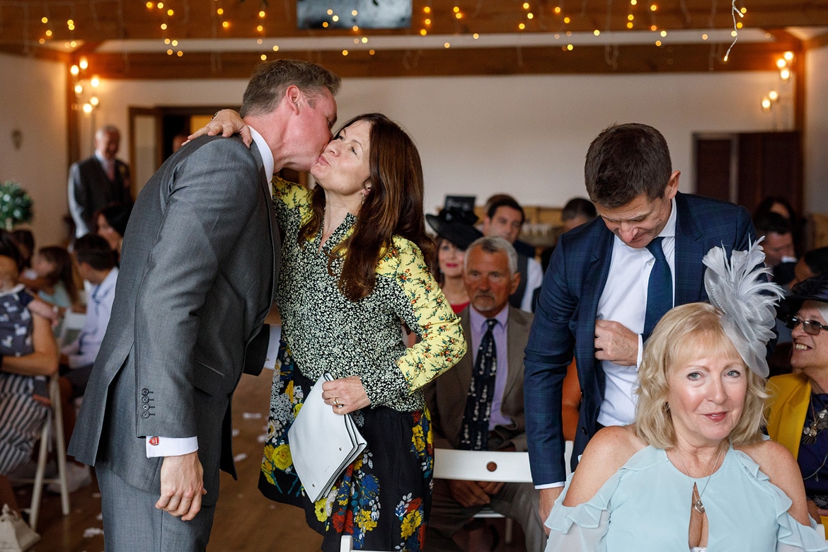 the groom greets his guests