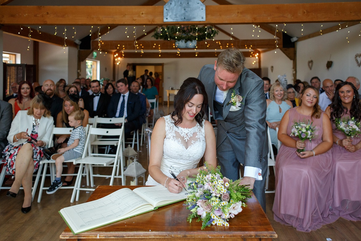 signing the register at maidens barn in essex