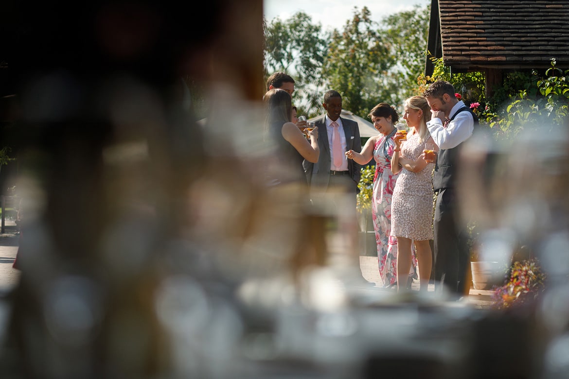 the wedding guests enjoying the august sunshine