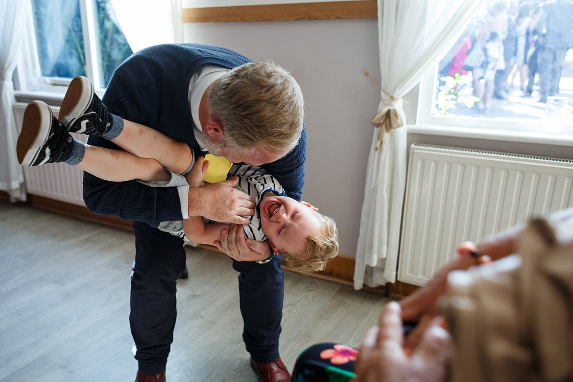 the groom laughs with his son