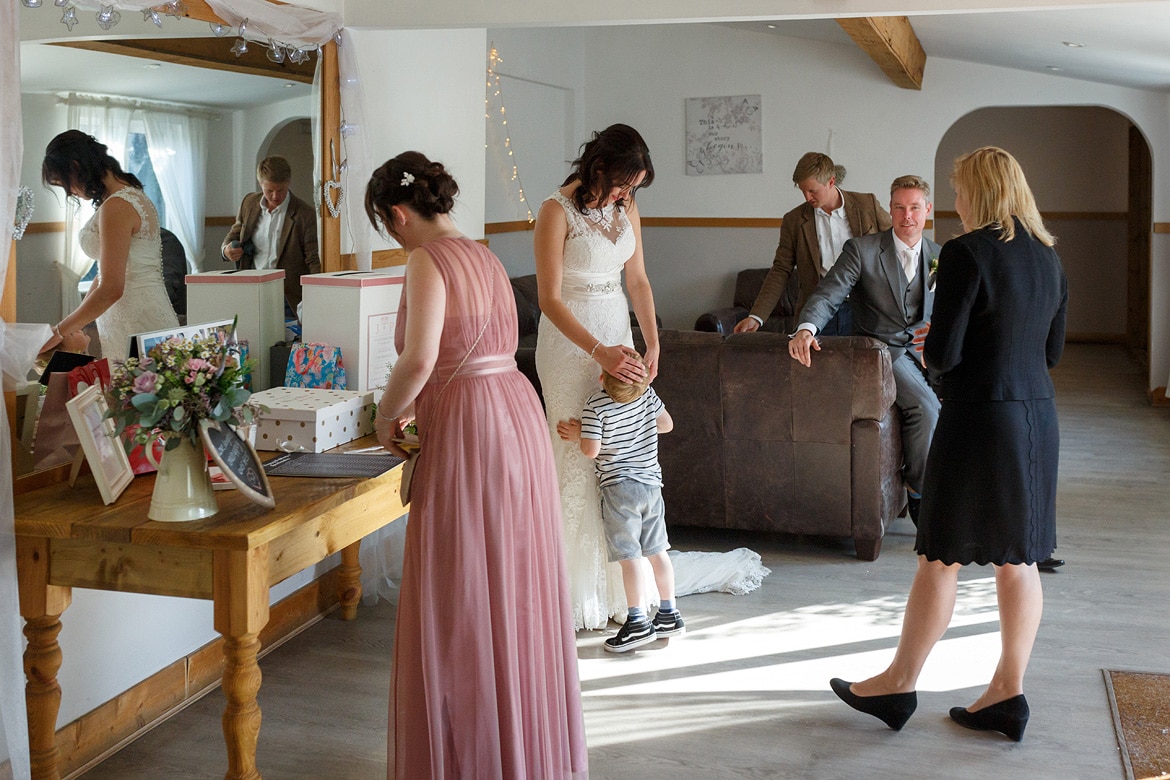 the bride and her son just before they enter the wedding breakfast