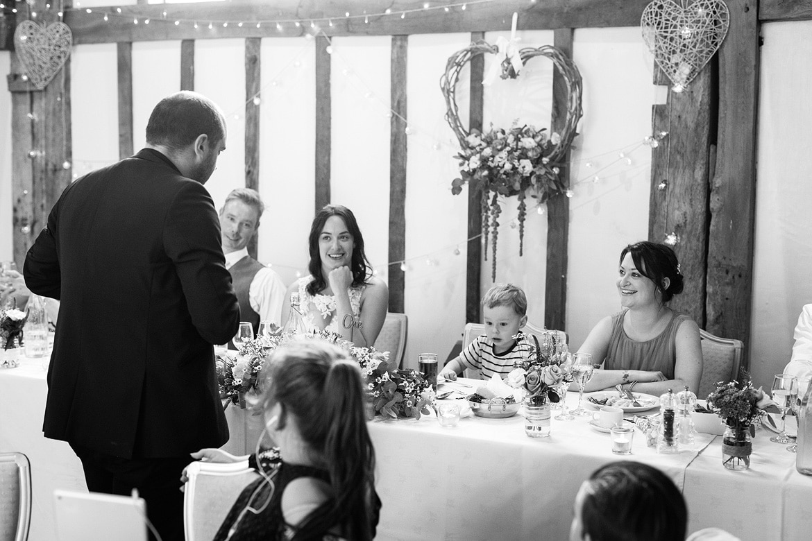 the bride and groom watch the magician