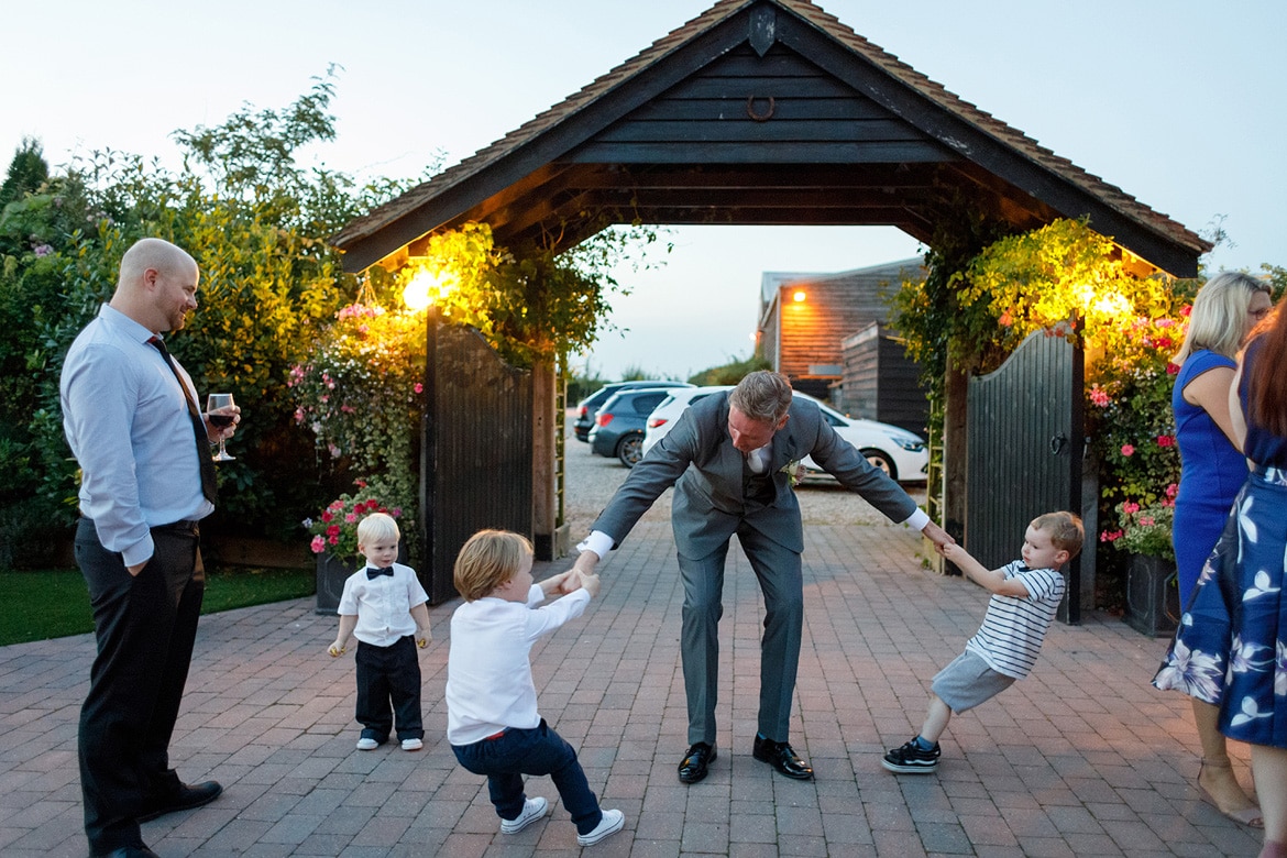 the groom is pulled by two children