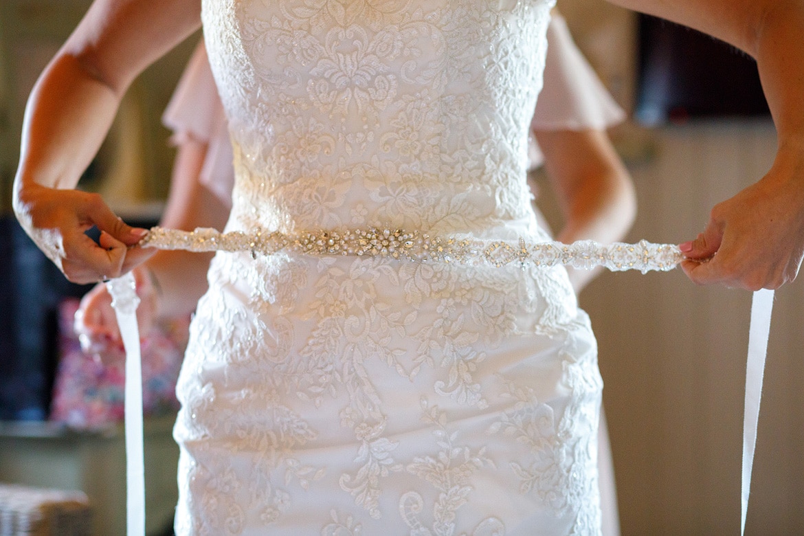 the bride gets dress at cley windmill