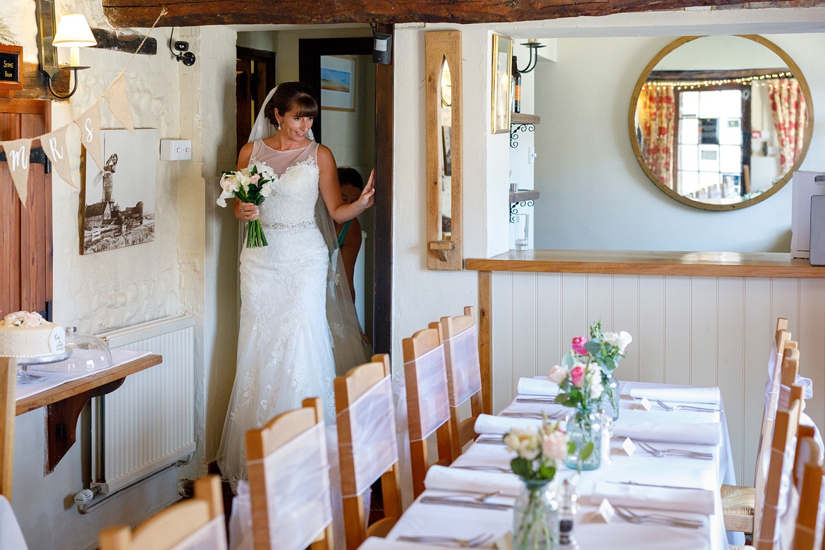 the bride enters the dining room at cley windmill