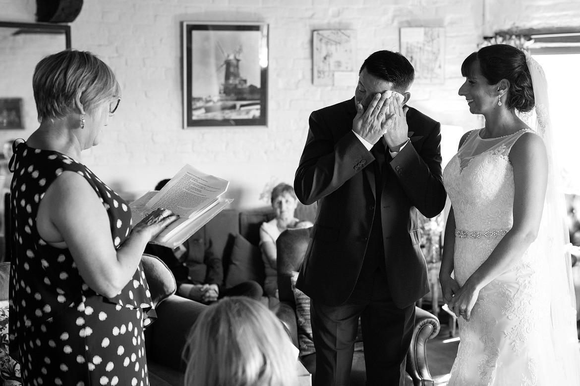 the grooms cools off during the ceremony