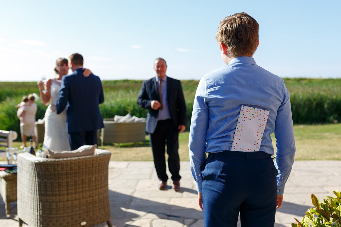 the pageboy hides a birthday card from the best man