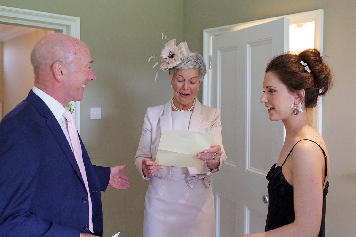 the bride and her parents before the ceremony