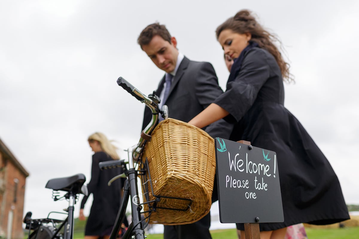 guests arrive at godwick barn for the wedding