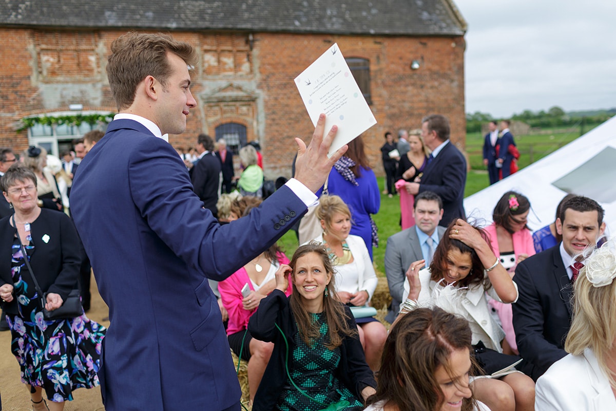 an usher hands out the order of service