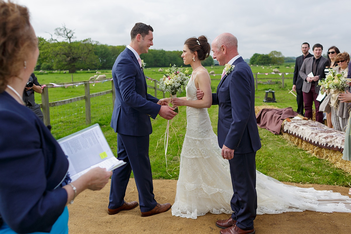 the groom greets the bride for their godwick barn wedding