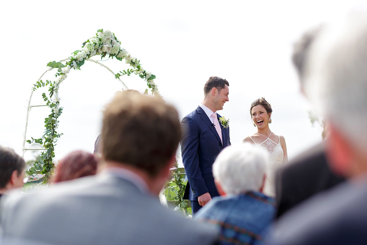 bride and groom share a joke