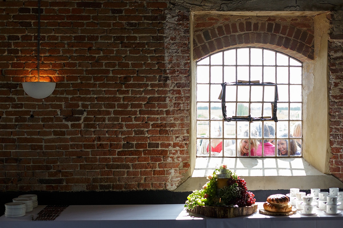 guest peer through the windows of the barn