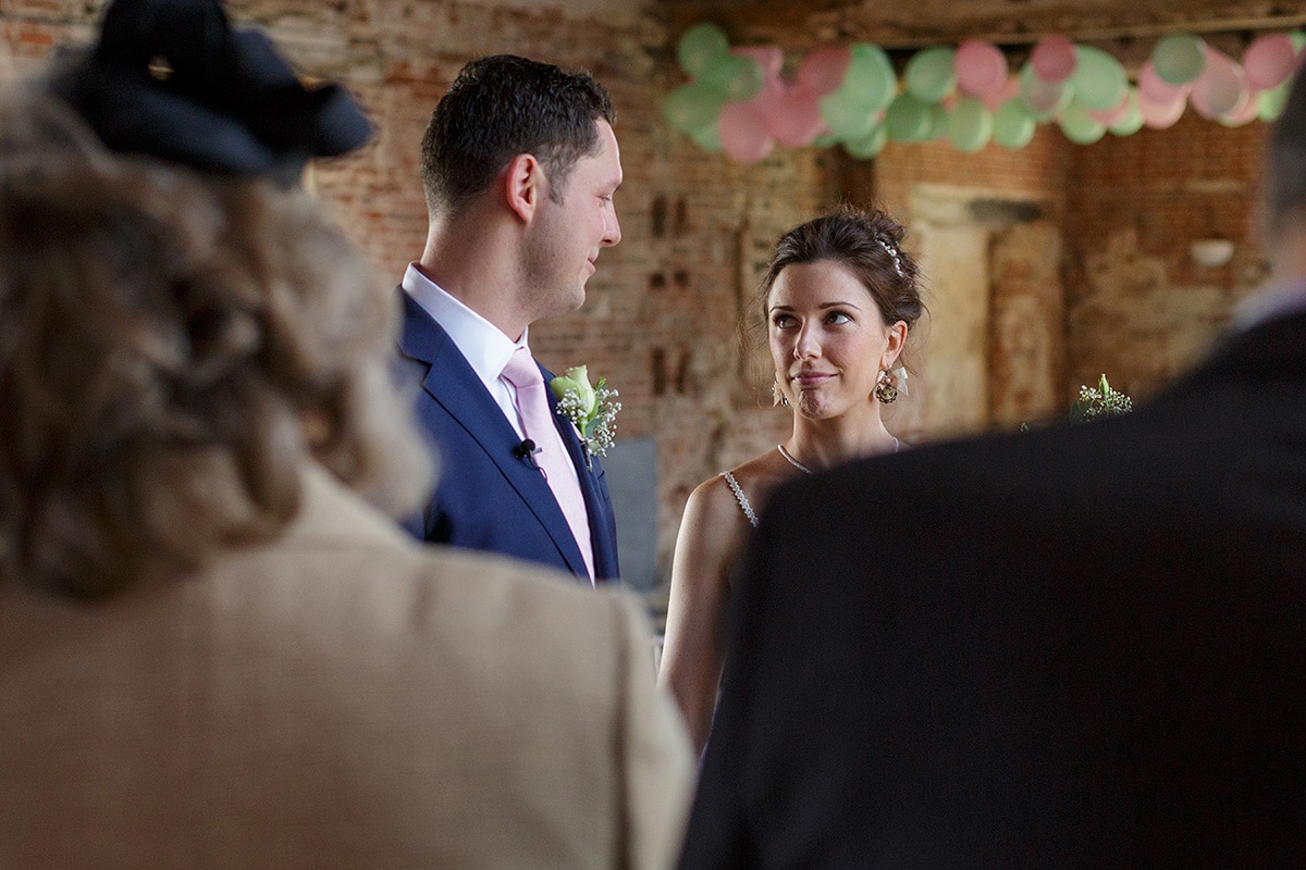 bride and groom exchange a nervous look