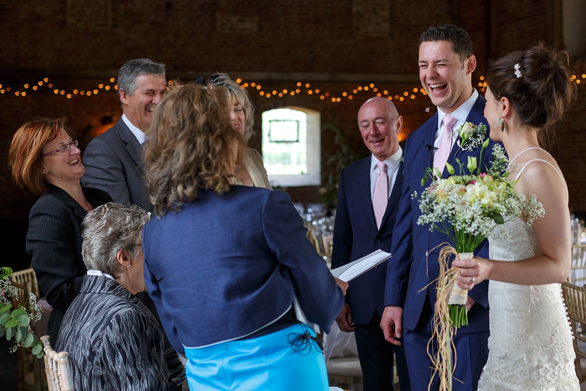 the groom laughing with the registrar