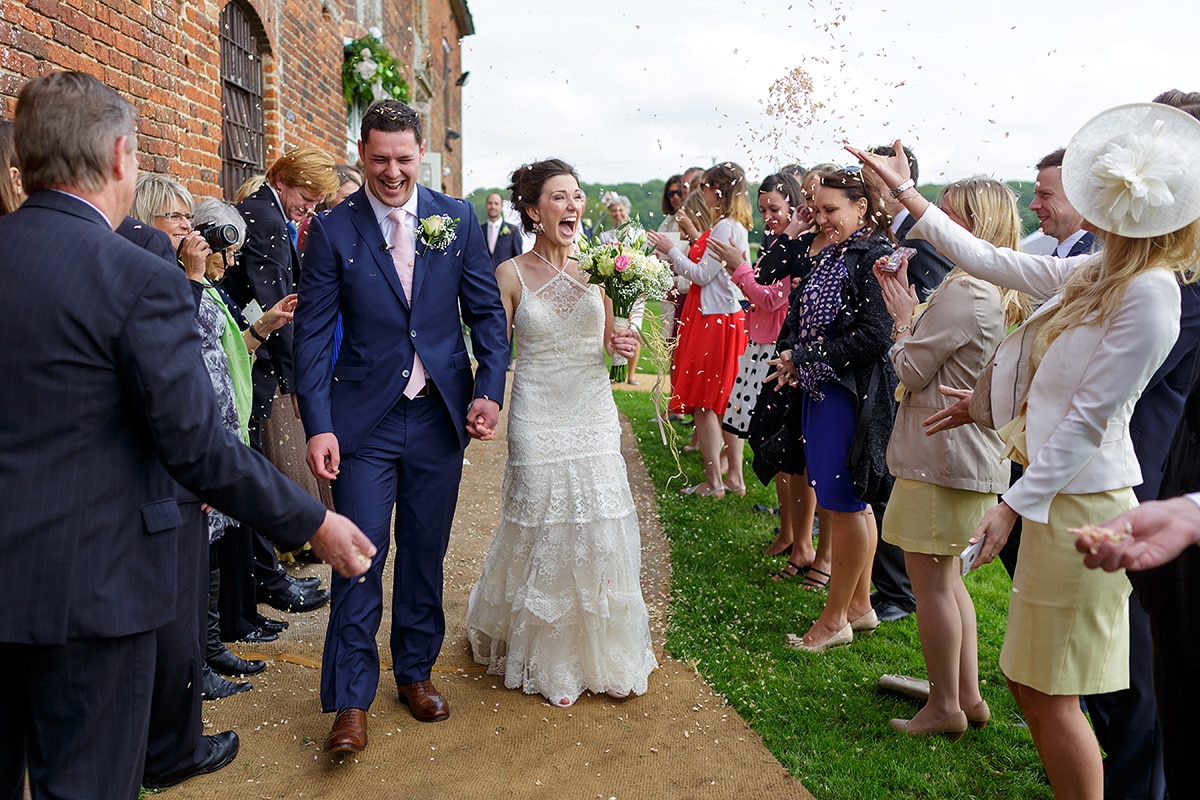 bride and groom walkthrough the confetti